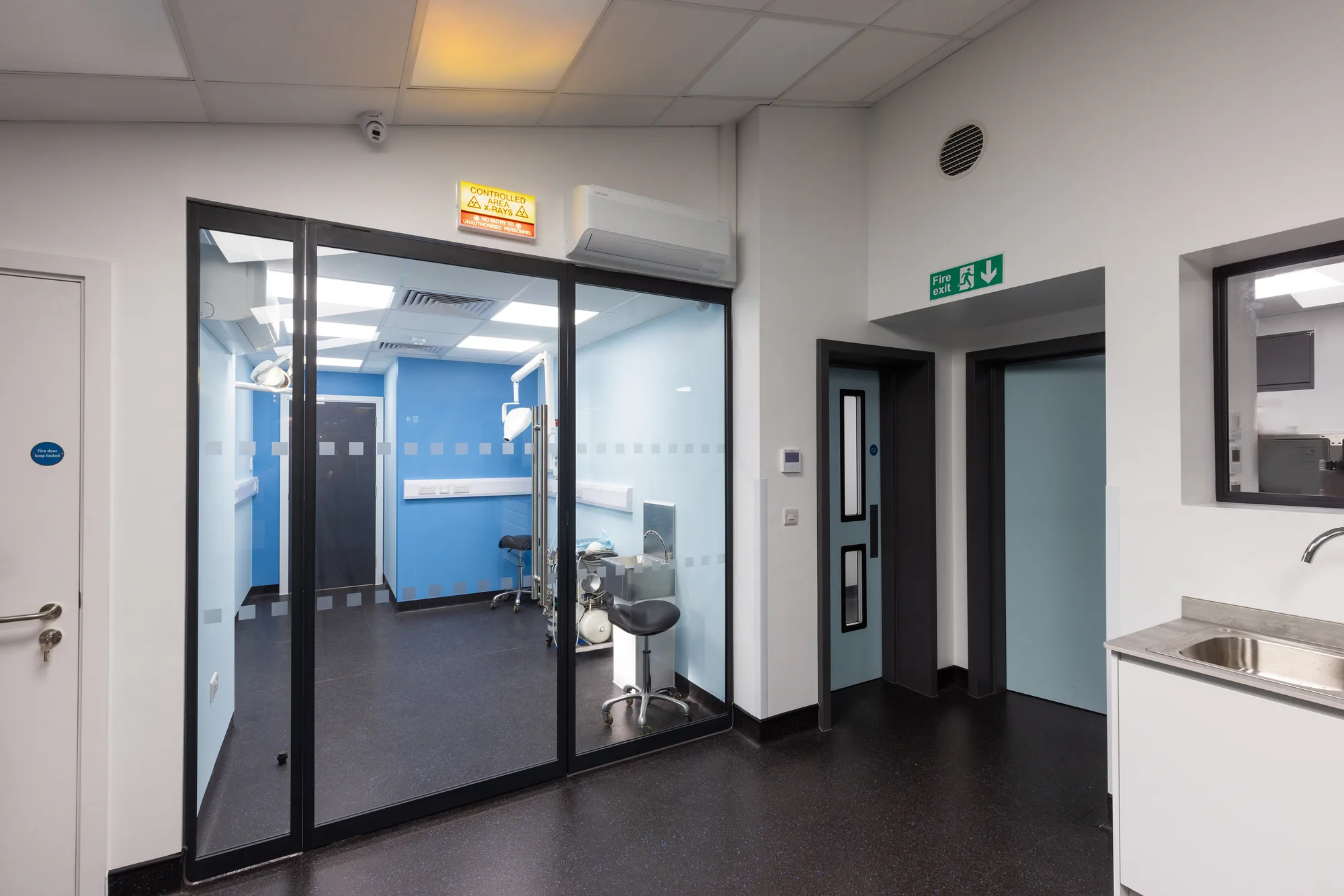 Corridor at Vetemis Referrals, Brownhills, with glazed partitions and clinical flooring