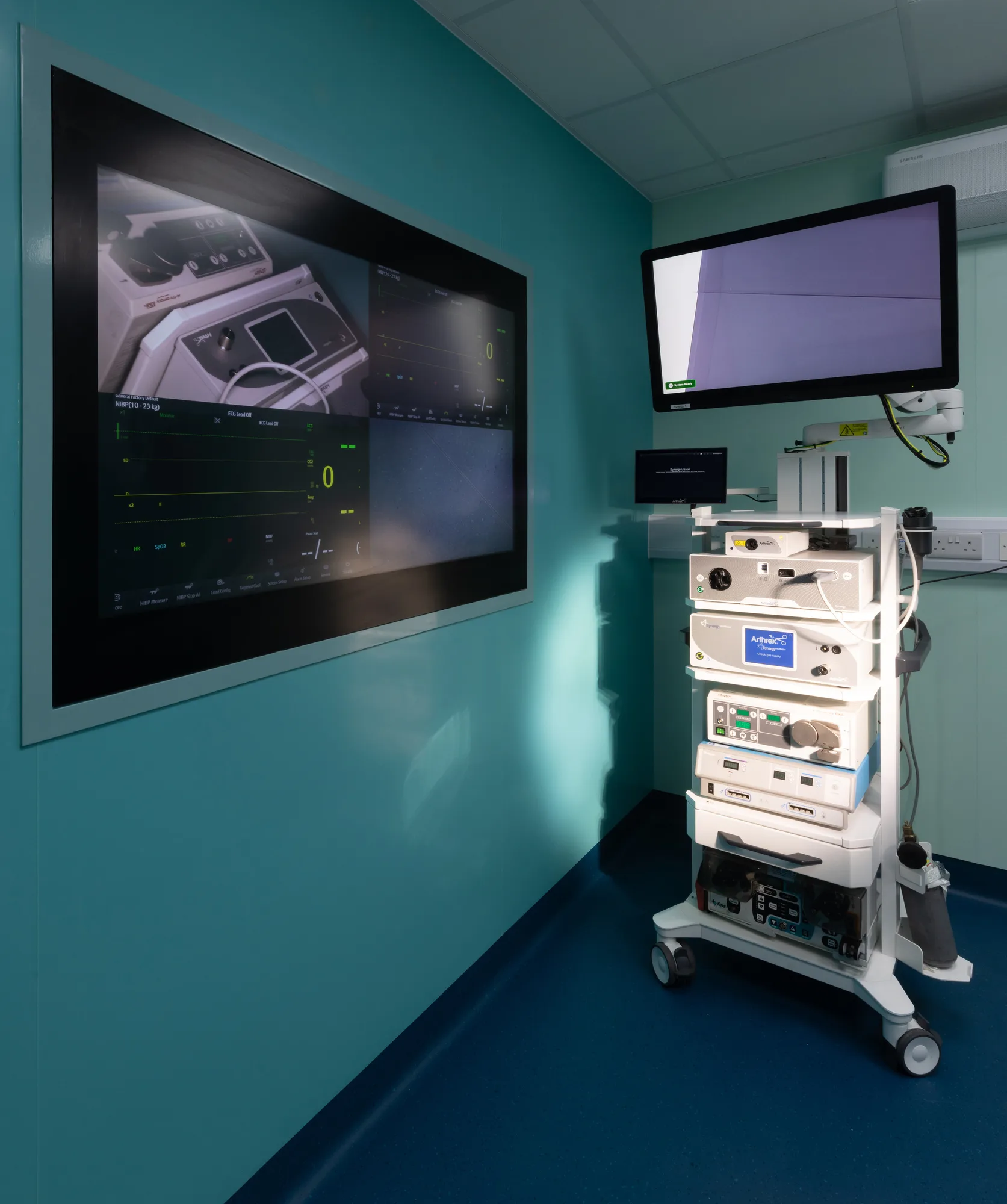 Wall-recessed theatre monitor and equipment tower at Vetemis Referrals, Brownhills, with the socket run in the wall trunking