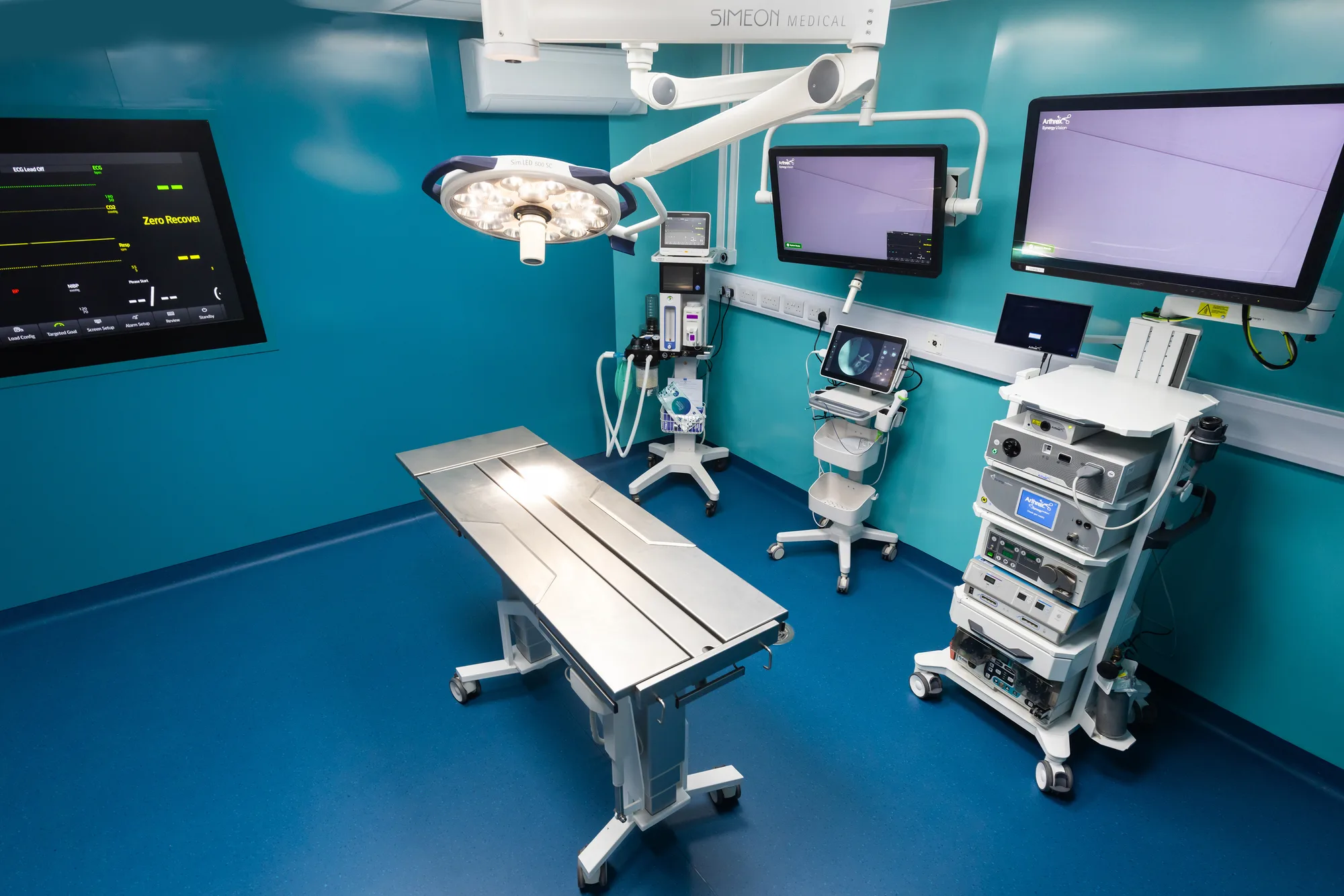 Operating theatre at Vetemis Referrals, Brownhills, with two surgical tables, anaesthetic towers and wall monitors