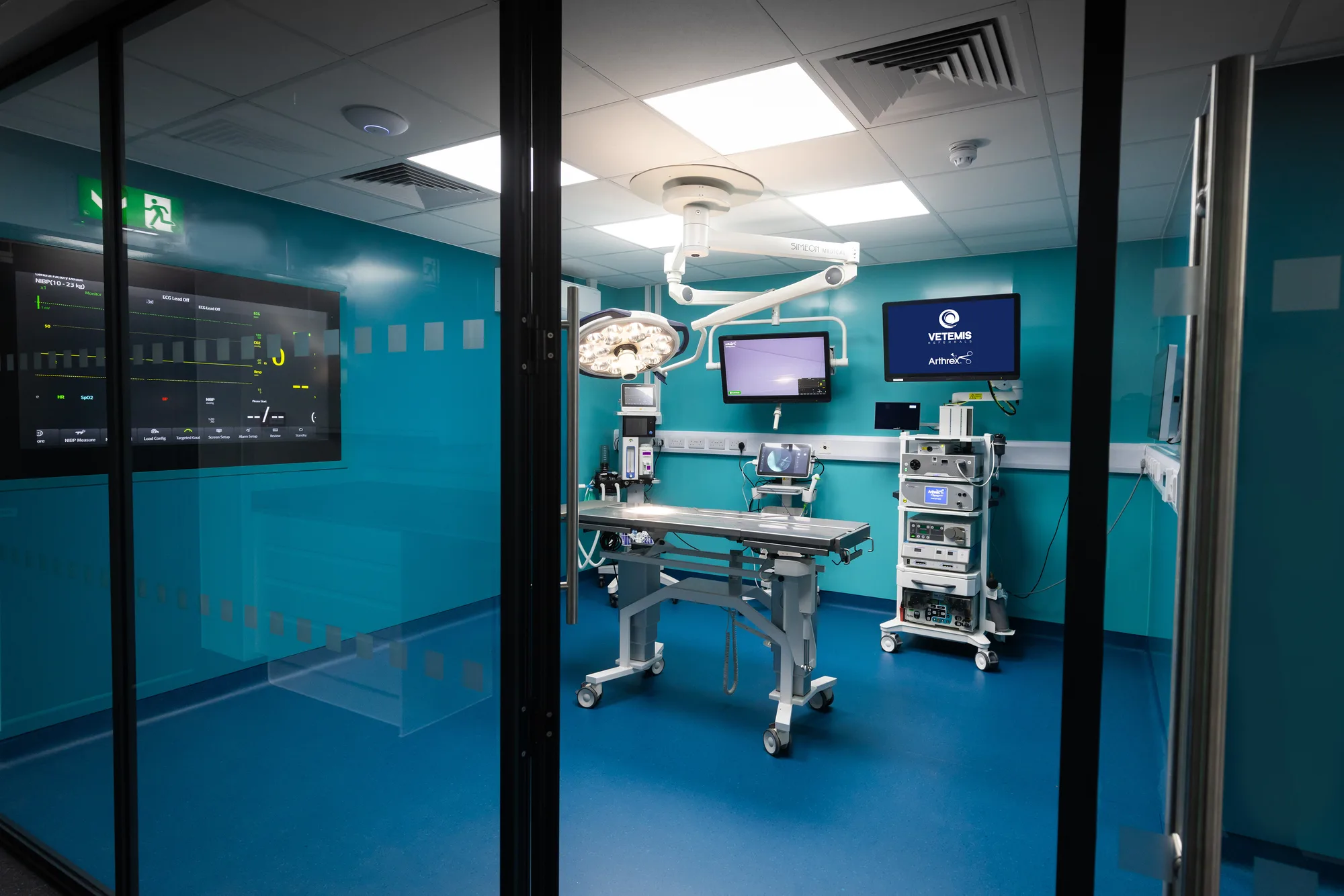 Operating theatre suite at Vetemis Referrals, Brownhills, through the glazed partition wall, with the surgical table and anaesthetic tower beyond